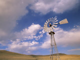Old Windmill on Ranch Under Blue Sky with Clouds