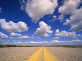 Cumulus Clouds in Blue Summer Sky Over Paved Road