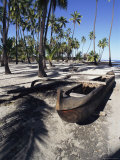 An Outrigger Canoe Rests on a Beach