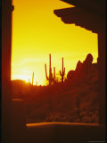 View Through a Hotel Window of a Desert Landscape at Sunset