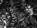 Carnival Masks in Black and White Displayed on a Wall in Venice