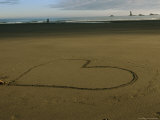 Heart Drawn in the Sand on a Beach