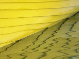 Yellow Boat Casting Its Reflection on the Water's Surface