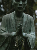 Statue of a Zen Buddhist Monk Holding Prayer Beads