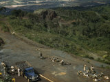 Laborers Load a Truck with Ore Found During Excavations of Caue Peak