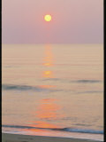 Sunlight Reflection on Calm Water at Twilight