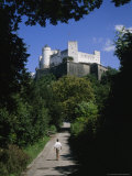 Salzburg Castle Dwarfs a Man Walking Towards It