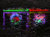 Abstracted Colors Reflect From Restaurant Lights on a Slushy Street