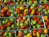 Baskets of Peppers Sit in a Farmers Market Waiting For a Sale