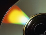 Close View of a Compact Disc Reflecting Rainbow Colors
