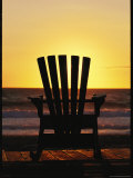 Lawn Chair on a Beach at Sunset