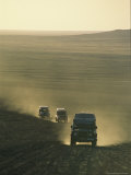 Land Rovers Kick Up Dust on the Old Caravan Road To Ghat