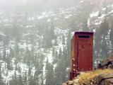 Outhouse Perches on a Hillside