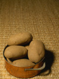 Baking Potatoes Sit in a Pot Ready To Be Cooked