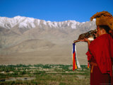 Monk Sounding Puja Horn across Valley  Thiksey Gompa