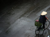 Person Cycling after Heavy Rain