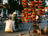 Man Sells Replicas of Military Hats from Bicycle