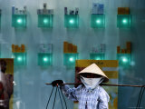 Street Vendor in Front of Showcase of Skincare Products