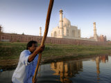 Boatman Poling across Yamuna River at Sunrise in Front of Taj Mahal