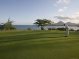 Men Playing Golf on Le Touessrok Golf Course