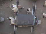 Overhead View of Men Pushing Rickshaw across Train Lines