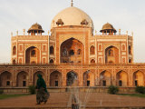 Woman Wearing Sari Walking Past Humayun's Tomb in New Delhi
