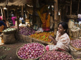 Woman Selling Onions in the Vegetable Market