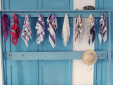 Hat Rack Filled with Head Scarves and One Hat at Entrance to Mosque