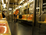 Man Looking at Map on Subway Train
