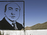 Former President Akaev Depicted in Black Metal Outline Atop Hillside
