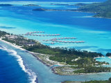 Aerial of Small Motu on Edge of Bora Bora Lagoon  with Over- The-Water Bungalows on Lagoon