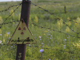 Sign on Barbed-Wire Fence of Radioactive Waste Dump in Use Within City Limits