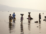 Ghanaians Collecting Water from Lake Volta at Dusk