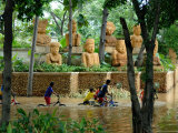 Children Riding Bikes Through Floodwaters