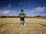 Torres Strait Islander Boy Standing in Goal During a Soccer Game