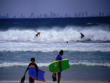 Surfers with Surfers Paradise in Distance