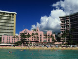 Exterior of the Royal Hawaiian Hotel with Waikiki Beach in Foreground