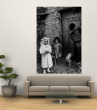 Lorenza Curiel in White First Communion Dress Waiting for Mother to Lock Door