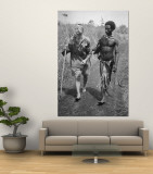 Papuan Native Helping a Wounded Australian Infantryman Along Road Away from the Buna Battlefront
