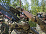 Soldier Operates a Missile Launcher While His Teammate Locates the Target
