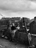 Woman Hanging Wash in a Dublin Slum