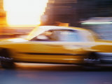 Blurred Motion of Taxi Cab on Busy Street in New York City