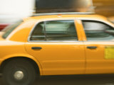Blurred Motion of a Speeding Taxi Cab on a Busy Street