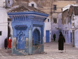 Traditionally Dressed Muslims in the Plaza Alhaouta  Morocco