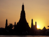Sunset Behind Temple of Dawn on Chao Phraya River  Thailand