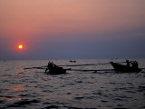 Silhouetted Boats on Lake Tanganyika  Tanzania