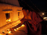 Monk Lighting Butter Lamps at Boudnath  Kathmandu  Nepal