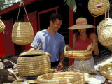 Couple Shopping for Baskets at Straw Market  Bahamas  Caribbean