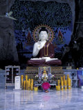 Monk Praying Near Buddha Statue  Thailand