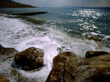 Rocky Shoreline with Salt Crystals Formed by High Salt Content of Dead Sea  Jordan